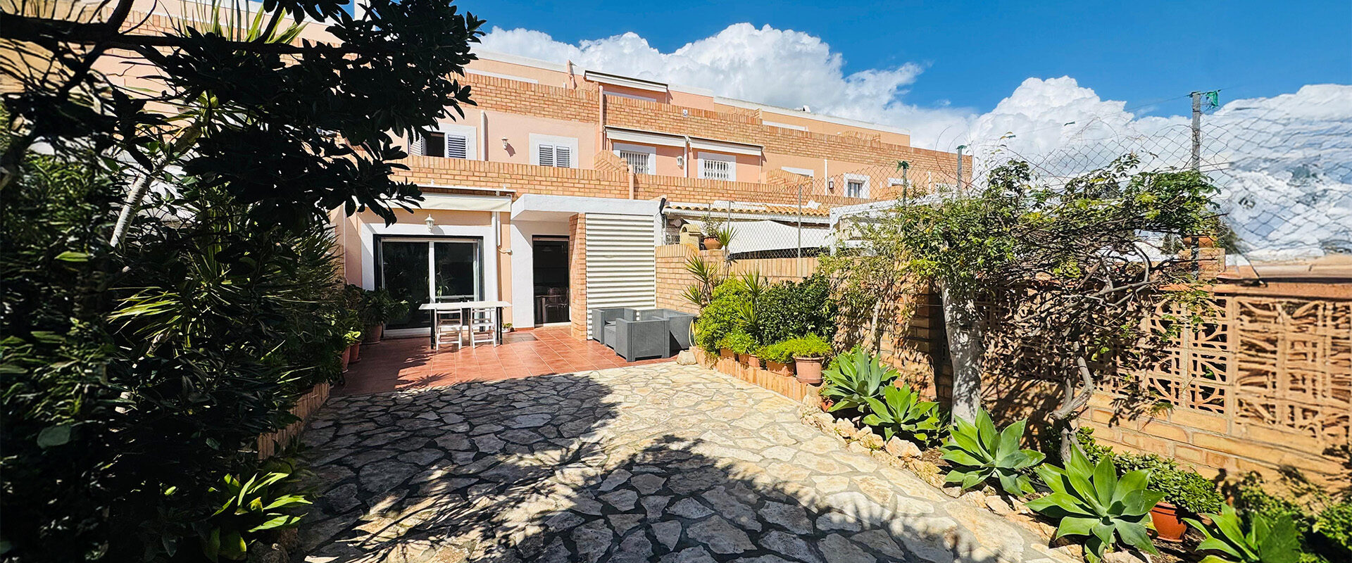 Elegant Triplex Townhouse with Private Garden in Es Vivé
