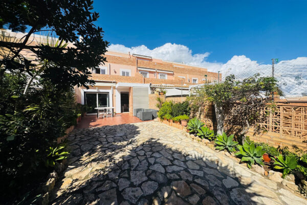 Elegant Triplex Townhouse with Private Garden in Es Vivé